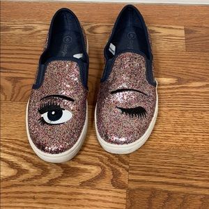 Pink sparkle slip on shoes with winking eye